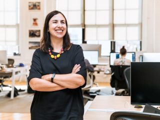 smiling-businesswoman-in-office_925x